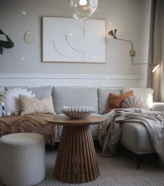 a living room filled with furniture and pillows