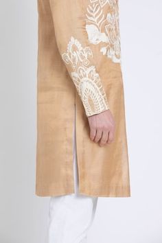 Gold straight kurta featuring ivory aari embroidery in floral and geometric pattern. Paired with contrasting plain pant. - Aza Fashions Wedding Chanderi Bandhgala With Embroidered Border, Fitted Raw Silk Sherwani With Embroidered Border, Wedding Bandhgala With Embroidered Border In Chanderi, Wedding Bandhgala With Embroidered Border, Raw Silk Sherwani With Embroidered Border And Straight Kurta, Raw Silk Sherwani With Embroidered Border, Sherwani With Embroidered Border In Raw Silk, Embroidered Border Sherwani In Raw Silk, Eid Fitted Kurta With Tonal Embroidery