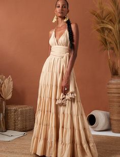 LOLA BOHEMIAN HALTER MAXI DRESS Flowy Beige Maxi Skirt For Beach, Beige Halter Neck Summer Maxi Dress, Beige Backless Maxi Dress For Summer, Elegant Beige Boho Maxi Dress, Summer Beige Backless Maxi Dress, Elegant Beige Halter Dress For Beach, Flowy Halter Floor-length Summer Dress, Elegant Beige Halter Dress For The Beach, Flowy Floor-length Halter Dress For Summer