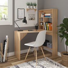 a white chair sitting in front of a desk with a book shelf next to it