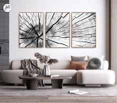 a living room with two paintings on the wall