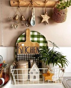 kitchen utensils hanging on the wall above a sink