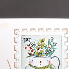 a stamp with an image of a cat holding a potted plant