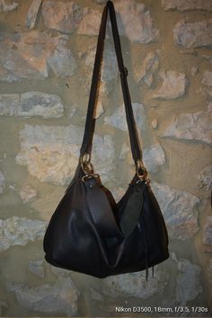 Handmade black leather medium size hobo bag with depth. The bag is closed with a metallic zip. Inside is unlined and there is a large cotton zipped pocket. The bag has an adjustable shoulder strap made with stronger black leather. To add an extra touch to the bag you can buy the short handle which measures 18 inch in length and is made with beautiful black leather. This medium size hobo bag is a perfect bag for every moment Features : - Black leather, - Black leather strap, - Zipped bag, - Unlin Black Leather Lined Hobo Bag For Everyday Use, Black Hobo Bag With Leather Lining For Everyday Use, Black Handmade Hobo Bag, Black Hobo Bag With Leather Lining, Elegant Black Hobo Bag With Snap Closure, Black Textured Leather Hobo Bag, Black Leather-lined Hobo Bag For Everyday Use, Black Hobo Bag With Leather Handles For On-the-go, Soft Leather Hobo Bag