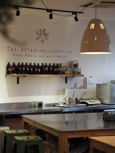 an empty restaurant kitchen with bottles on the wall