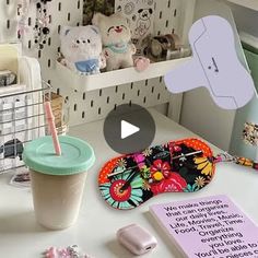 a white desk topped with lots of crafting supplies and items on top of it