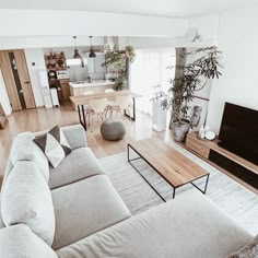 a living room filled with furniture and a flat screen tv