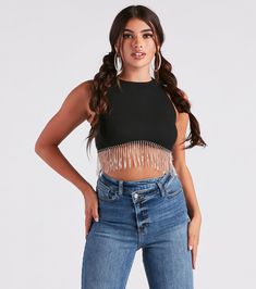 The benefits of adding this crop top to your closet are endless! Update your basics with this sleeveless top featuring a high neck, back zipper and hook-eye closure, fitted silhouette, and rhinestone fringe trim along the hem. The top is composed of stretchy rib-knit fabric. Style this top with best-selling jeans to complete the look!Fit & FeaturesSleeveless high neckBack zipper and hook-eye closureFitted silhouetteRhinestone fringe trim along the hemRib-knit fabricModerate stretchRuns true Black Fringe Top Outfit, Fringe Tops For Women, Trendy Cropped Halter Top For Club, Edgy Cropped Tank Top For Night Out, Glamorous Stretch Cropped Crop Top, Black Fringe Top, Corset Outfits, High Neck Crop Top, Rhinestone Fringe