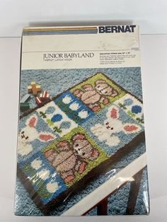 the front cover of a book with an image of a baby's blanket on it