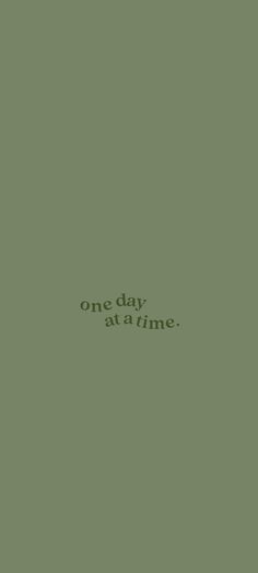 the words one day at a time are written in green