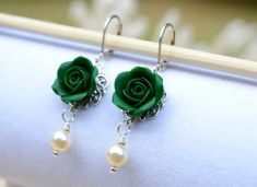 The Listing is for a pair of Hand sculpted Green Rose Flower Earrings. 3 options of Rose Earrings to choose from: 1. Emerald Green Rose 2. Evergreen Rose 3. Dark Teal Note :Variety Green Rose colors available as seen in the last picture, drop the color name when you check out. If you need the detail pictures, please convo me. Material in this Earrings: Rose Flower size is approximately 13-14mm. Attached on Filigree. 6mm Ivory/Cream Swarovski Pearls . Drop a note if you prefer white Swarovski pea Green Flower Earrings With Ear Wire For Wedding, Green Flower Earrings For Wedding With Ear Wire, Green Flower Earrings, Rose Colors, Prom 2024, Pearls Earrings, Green Bridesmaid, Green Theme, Make Beauty