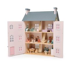 a doll house with all the furniture and accessories in it's pink display case