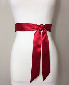 "Narrow Crimson Sash Crimson Red Satin Sash Dark Red Bridesmaid Sash Deep Red Wedding Dress Sash Crimson Satin Sash Belt Satin Swank Now in a narrow version, this Satin Swank® waist sash is the perfect finishing touch for your wedding, bridesmaid, or special occasion dress, or just the right piece to add instant polish to your dress or top. Depending on your waist size and the length you choose, you can wrap the sash around your waist once or up to three times. You decide whether to tie the sash Elegant Red Wedding Sash, Satin Sashes For Bridesmaids, Satin Ribbon Bridal Belt For Parties, Elegant Red Sash For Party, Elegant Red Party Sash, Satin Sashes With Ribbon For Gift, Formal Satin Bridal Belt With Ribbon, Deep Red Wedding, Red Bridesmaid