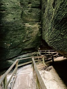 the stairs lead up to an underground cave