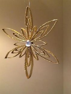 a gold ornament hanging from the ceiling