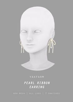 a white mannequin head with earrings on it