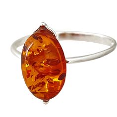 "* Materials: Baltic Amber, 925 Sterling Silver * Stone size: 0.5\"X 0.25\"(12.7 mm x 6.3 mm) * Weight: between 1.4 grams and 1.65 gram - depending on the size you pick. * Available in sizes 4-9.5 * Healing Benefits: The natural Baltic amber stone is known worldwide for its mental and spiritual healing benefits- it will also do wonders for your body's immunity system. * Included: The package includes one 925 sterling silver ring with natural amber stone and a hand-selected premium jewelry box. * Amethyst Crystal Necklace, Gold Dragon, Amber Ring, Amber Stone, Dragon Pendant, Amber Jewelry, Nature Jewelry, Amethyst Crystal, Minimalist Jewelry