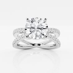 a white gold engagement ring with an oval cut diamond in the center and two rows of diamonds on each band