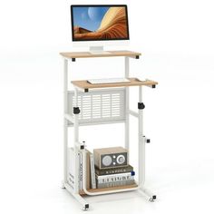 a computer desk with a monitor on top of it