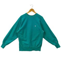 "Vintage 90s Champion Reverse Weave Crewneck Sweatshirt Champion Sweater Pullover Warm Up Plain Champion Logo Embroidery Teal Green Large * Used item. In good condition (7/10) minor signs of wear got some light spots small tear on sleeve near cuffs (view photos) * Tagged size Large. Flat laid measurements in inches (appox) - Chest (underarm to underarm) : 21\" - Length (side of neck seam to bottom hem) : 28\" - Shoulder (seam to seam) : 19\" - Sleeve (shoulder seam to cuff end) : 24.5\" BUY 3 IT Champion Sweater, Champion Logo, Champion Reverse Weave, Sweater Jumper, Sweater Pullover, Logo Embroidery, Teal Green, Embroidery Logo, Shoulder Sleeve