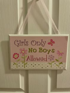 a sign hanging on the door saying girls only no boys allowed