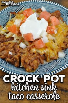 crock pot taco casserole on a blue and white plate with text overlay