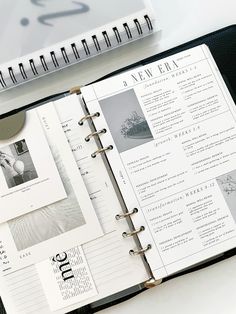 an open planner book sitting on top of a desk