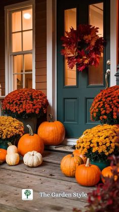 pumpkins and gourds are sitting on the porch