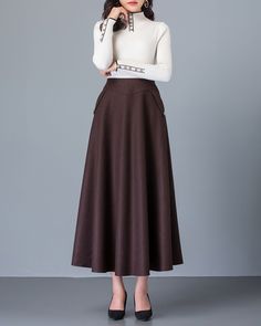 * A high-end long wool skirt with wide hem, very cool. * Made of wool blends, fully lined and with two side pockets. * Fixed waist on front, partial elastic waist on back and side invisible zipper. * Can custom make waist size and skirt length. * Material: Outer-50% wool, 50% polyester; lining-100% polyester * Washing instructions: Dry Clean Only * Size: True to US size, US 0-US 20 are available, you can let us know your usual size and height in your order. * Shipping: Free shipping Processing t Fitted A-line Brown Maxi Skirt, Winter Fitted Brown Maxi Skirt, Winter Brown Fitted Maxi Skirt, Brown Long Skirt For Winter, Brown Long Skirt Bottoms For Winter, Beige Maxi Skirt For Fall, Brown Full Skirt For Winter, Brown Midi Skirt For Fall, Brown A-line Skirt For Workwear