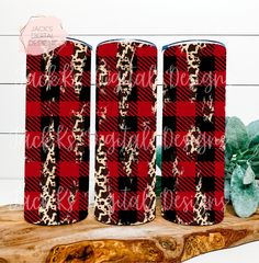 two flasks with leopard print on them, one is red and the other is black