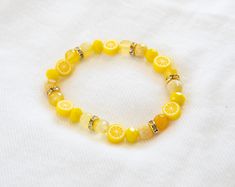 Lemon Bracelet Beads are glass, metal, and semi-precious stones, the lemons are clay beads.  Each bracelet is 7- 8 inches long (depending on bead pattern) but is made of very stretchy (and strong) elastic. Yellow Stretch Bracelet With Faceted Beads For Gift, Adjustable Yellow Faceted Beads Stretch Bracelet, Lemon Bracelet, Aesthetic Bracelet, Lemon Seeds, Virginia Beach Va, Bead Pattern, Complimentary Colors, Bracelet Ideas