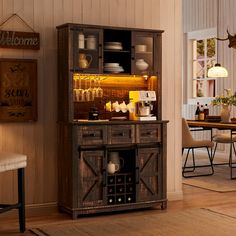 a dining room with a table, chairs and an old fashioned bar in the corner