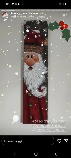 an image of santa claus in the snow with holly and mist on it's back