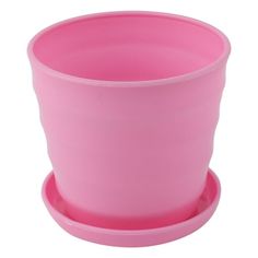 a pink cup sitting on top of a saucer