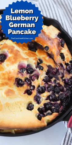 lemon blueberry german pancake in a cast iron skillet with text overlay