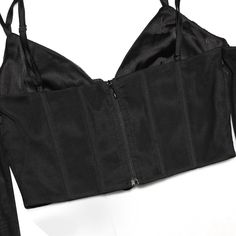 Introducing our Halter Corset Top in Black - the perfect blend of elegance and allure. The halter neckline and corset-inspired detailing create a flattering silhouette that's perfect for any occasion. Made with high-quality fabric, this top is designed to hug your curves in all the right places. The versatile design makes it ideal for dressing up or down, making it a must-have addition to any fashion-forward wardrobe. Elevate your style game with our Halter Corset Top in Black and make a bold fa