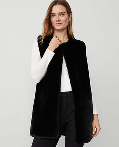 Irresistibly soft, our fuzzy faux fur vest is a cozy comfort. 33 1/2"L x 21 3/4"W.,Imported:Imported,Fabrication:100% Polyester,Garment Care:Machine Washable Fuzzy Faux Fur Vest by Ann Taylor Size regular - M/L Black Women's Ponchos, Wraps, Kimonos, Fashion, Accessories, 100%, Polyester, Machine, Washable Black Fur Vest Outfit, Long Vest Coat, Fur Vest Outfits, Black Fur Vest, Ladies Poncho, Long Vest, Long Vests, Faux Fur Vest, Vest Coat