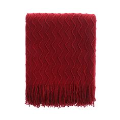 a red blanket with fringes on it