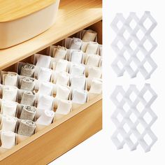 the drawer is filled with different types of kitchen utensils and paper towel holders