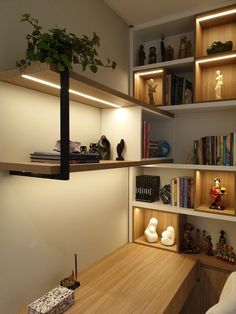 a wooden desk topped with lots of shelves filled with different types of books and figurines