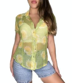 90’s sunflower sheer shirt Brand: InCharge super cute button down modeled with a white push up bra under perfect for summertime with your favorite pair of denim shorts 90s Beach Tops For Spring, 90s Style Spring Beach Tops, 90s Style Tops For Spring Beach Outing, Y2k Style Button-up Summer Tops, Trendy Summer Blouse With Button Closure, 90s Floral Print Summer Tops, Retro Summer Button-up Blouse, 90s Style Floral Print Summer Tops, Retro Summer Blouse With Button Closure