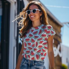 Get ready to slice into summer fun with our Watermelon Wonderland Tee! 🍉🌞 Embrace the sweet, juicy vibes as you don this shirt adorned with a mouthwatering array of watermelon wedges, bursting with vibrant colors and refreshing flavor! 🌈🍉 Whether you're a fruit fanatic, a lover of summertime bliss, or simply seeking a tee that's as cool as a slice of melon on a hot day, this design is your perfect match. Crafted from premium fabric and featuring a print that's as refreshing as a dip in the pool, it's the ultimate choice for those who want to add a splash of sweetness to their wardrobe. So grab a slice, soak up the sun, and let the Watermelon Wonderland Tee be your stylish companion for a summer adventure like no other! 🌟🍉 * 95% polyester, 5% elastane (fabric composition may vary by 1 Playful Red T-shirt For Summer, Playful Red Tops For Vacation, Fun Summer Vacation Tops, Playful Green Summer Tops, Red Strawberry Print Top For Summer, Playful Green Tops For Summer, Cute Green Summer Top, Playful Red Summer T-shirt, Spring Tops With Fruit Print