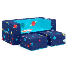 three storage boxes with outer space designs on the top and bottom, one in blue