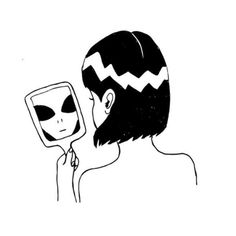 a person with an alien mask looking at their face in the mirror