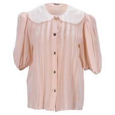 Elevate Your Wardrobe With The Miu Miu Pleated Peter Pan Collar Shirt In Peach Silk Crepe. This Enchanting Shirt Features A Delicate Peach Silk Crepe Fabric That Drapes Elegantly, Offering A Soft And Luxurious Feel. The Playful Pleated Detail And Classic Peter Pan Collar Add A Touch Of Vintage Charm, Making It A Versatile Piece For Both Sophisticated And Casual Outfits. Perfect For Adding A Hint Of Refinement To Your Everyday Look Or Dressing Up For Special Occasions, This Shirt Embodies Timeles Silk Crepe Fabric, Peter Pan Collar Shirt, Blouses Vintage, Embellished Blouse, Silk Tank Top, Silk Tank, Collar Shirt, Crepe Fabric, Silk Crepe