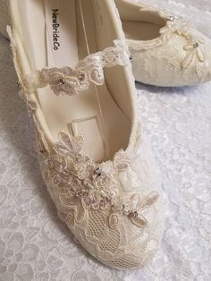 Ivory, or Off-white color lace over satin flat shoes. THESE SHOES DESIGNS ARE HAND DYED AND EMBELISHED TO ORDER THEREFORE, SHOES CAN NOT BE RETURNED OR EXCHANGED; PLEASE MEASURE YIUR FEET LENGHT TO CONFIRM YOUR SIZE FOR THESE PARTICULAR SHOES I'LL MAKE ALL THE EFFORTS TO HELP YOU HAVE A PLEASANT SHOPPING EXPERIENCE. ALTHOUGH THE PICTURES LOOK IVORY, IT IS ACTUALLY OFF-WHITE. HERE'S THE LINK FOR IVORY COLOR: YOU CAN CONTACT ME IF, YOU NEED TO PREVIEW COLOR, I CAN SEND A SWATCH SAMPLE https://www. Formal Wedding Shoes With Lace Trim And Closed Toe, Cream Lace-up Wedding Shoes For Ceremony, Elegant Wedding Shoes With Lace Work, Vintage Wedding Shoes With Almond Toe, Lace Wedding Shoes With Lace Trim And Round Toe, Elegant Lace Flat Heel Wedding Shoes, Cream Lace Pointed Toe Wedding Shoes, Lace Wedding Shoes With Round Toe And Lace Trim, Lace Wedding Shoes With Round Toe For Ceremony