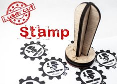 rubber stamp with the word stamp printed on it and some stamps in front of it