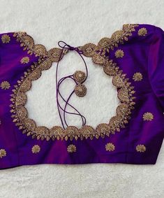 Hand embroidered ready made saree blouse / crop top/stitched saree blouse usa / purple U neck  saree blouse/ hand embroidered blouse/zardosi blouse/U neck  saree blouse/ purple pure silk blouse/ maggam work blouse        It is very true that a perfect blouse is the one which makes your saree look stand out !! If you find one of such a style that you have been wanting to have then dont let it go !! we carry such unique trending blouses that instantly add a stylish look to any saree !!     Well..!! we understand that you may not get in your desired size/pattern, here you go with customization according to your size/pattern which we can deliver in 1-2 weeks of time period !!      Here is a beautiful Hand embroidered saree blouse in purple color that has simple cutwork embroidery on necks and Cheap Bohemian Blouse With Zari Work, Simple Handwork On Blouse, Luxury Purple Embroidered Blouse Piece, Purple Zari Work Blouse For Diwali, Purple Embroidered Blouse For Festivals, Diwali Purple Blouse With Zari Work, Purple Designer Blouse For Diwali, Designer Purple Blouse For Diwali, Festival Embroidered Purple Blouse Piece