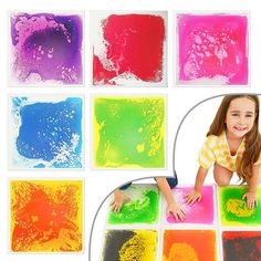 a child is playing with colored paint on the floor and in front of them are pictures of different colors