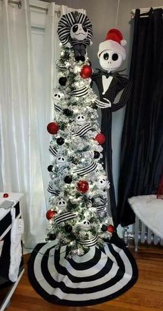 a christmas tree decorated with black and white ornaments